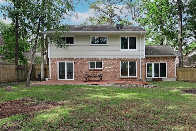 3 Meadow Beauty, The Woodlands, TX 77381 - rear view of house with brick siding and a patio area