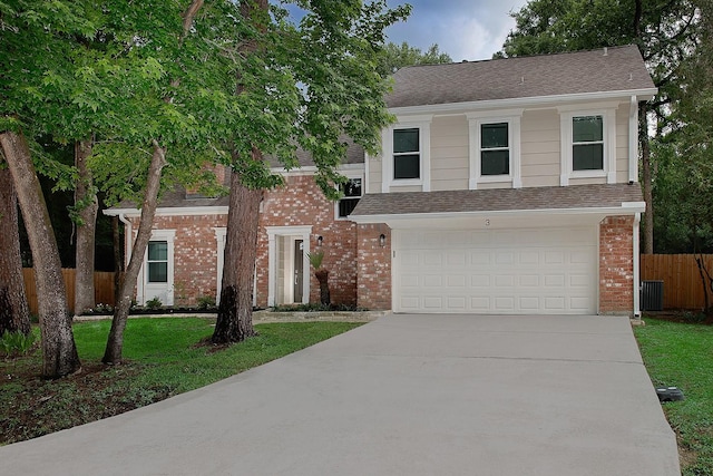 3 Meadow Beauty, The Woodlands, TX 77381 - view of front of property featuring concrete driveway, an attached garage, central AC unit, and brick siding
