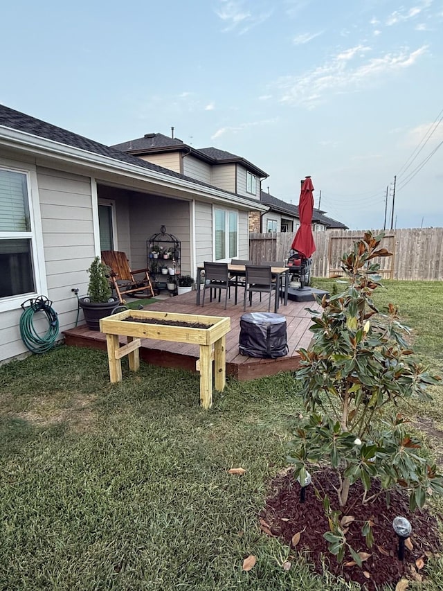 29919 Gallatin River Ln, Katy, TX 77494 - rear view of house featuring outdoor dining space, a deck, and a shingled roof
