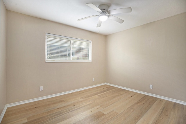 5927 Maco St, Galveston, TX 77551 - empty room featuring light wood finished floors, baseboards, and a ceiling fan