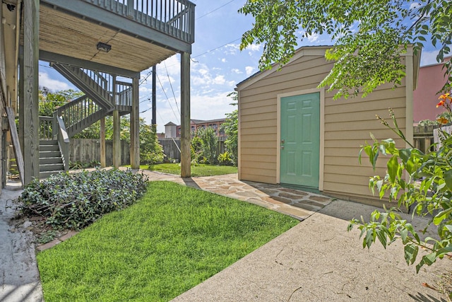 5927 Maco St, Galveston, TX 77551 - view of yard featuring stairway and a patio area
