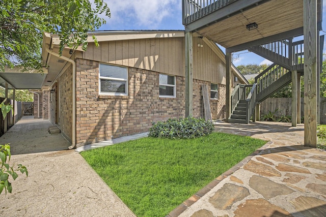 5927 Maco St, Galveston, TX 77551 - exterior space with stairway and brick siding
