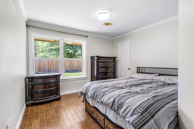5330 Pine Cliff Dr, Houston, TX 77084 - bedroom featuring baseboards, crown molding, and wood finished floors