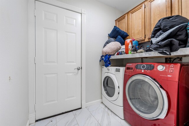 5330 Pine Cliff Dr, Houston, TX 77084 - laundry area with washer and clothes dryer, cabinet space, light marble finish flooring, and baseboards