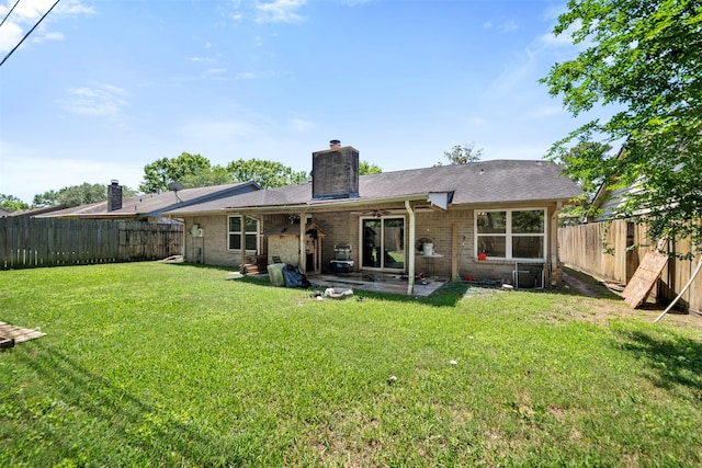5330 Pine Cliff Dr, Houston, TX 77084 - rear view of house featuring a chimney, a patio, brick siding, and a ceiling fan