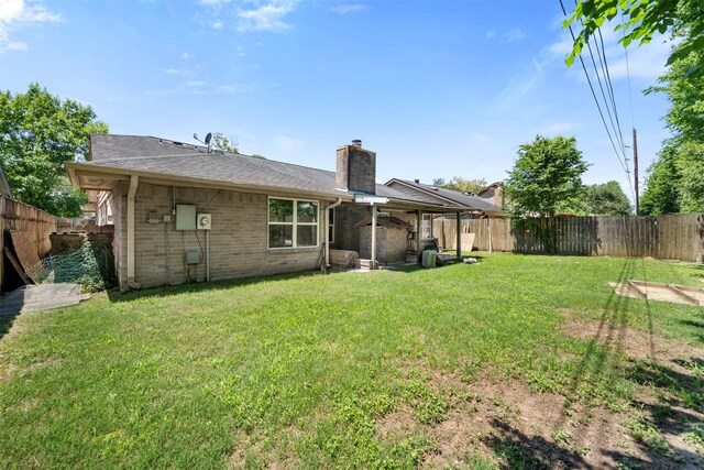 5330 Pine Cliff Dr, Houston, TX 77084 - back of property featuring a chimney and brick siding