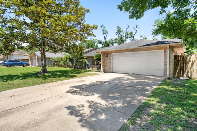 5330 Pine Cliff Dr, Houston, TX 77084 - ranch-style home with brick siding, driveway, and a garage