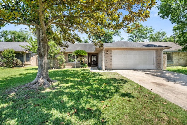 5330 Pine Cliff Dr, Houston, TX 77084 - ranch-style home with a garage, brick siding, driveway, and a front yard