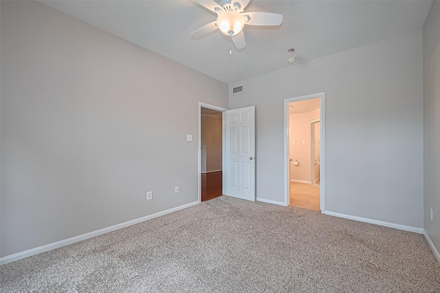 1330 Old Spanish Trl Unit 8306, Houston, TX 77054 - unfurnished bedroom featuring light colored carpet, baseboards, and ensuite bathroom