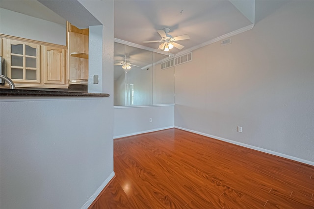 1330 Old Spanish Trl Unit 8306, Houston, TX 77054 - empty room featuring a ceiling fan, wood finished floors, crown molding, baseboards, and a sink