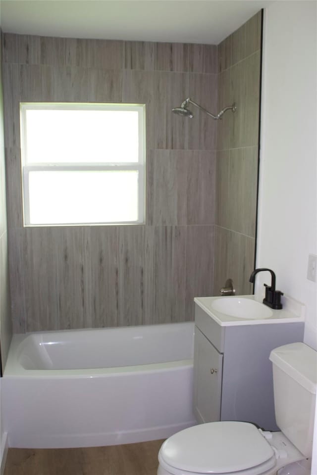 3922 Alsace St, Houston, TX 77021 - bathroom featuring toilet, shower / bath combination, vanity, and wood finished floors