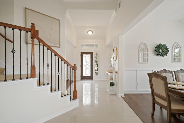 20719 Kerby Pl, Cypress, TX 77433 - tiled foyer entrance with ornamental molding, stairs, a wainscoted wall, and a decorative wall