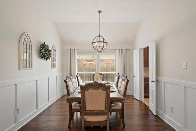20719 Kerby Pl, Cypress, TX 77433 - dining space with lofted ceiling, a chandelier, a decorative wall, wainscoting, and dark wood finished floors