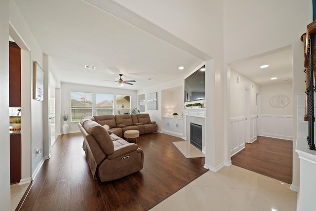 20719 Kerby Pl, Cypress, TX 77433 - living room featuring a fireplace with flush hearth, a ceiling fan, wood finished floors, and recessed lighting