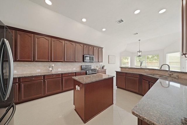 20719 Kerby Pl, Cypress, TX 77433 - kitchen with stainless steel appliances, a sink, tasteful backsplash, dark stone countertops, and recessed lighting