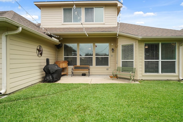 20719 Kerby Pl, Cypress, TX 77433 - back of house featuring roof with shingles, a patio area, and a lawn