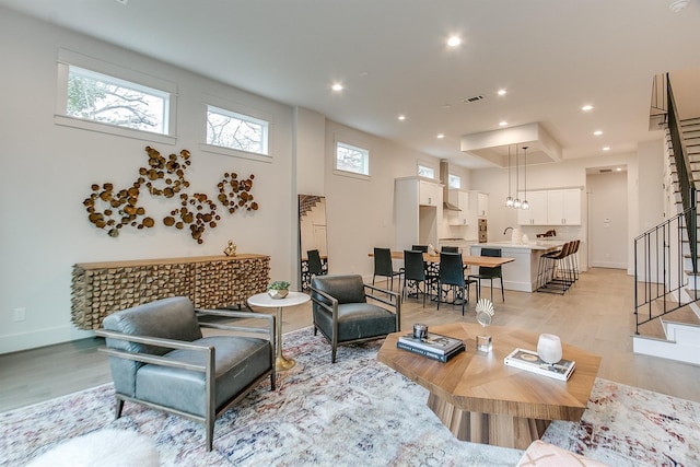 1514 Laird St Unit A, Houston, TX 77008 - living area with light wood-style floors, stairway, healthy amount of natural light, recessed lighting, and baseboards