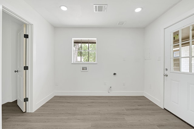 124 Rolling Wood Dr, Baytown, TX 77520 - washroom with recessed lighting, light wood-style flooring, baseboards, hookup for a washing machine, and hookup for an electric dryer