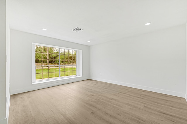 124 Rolling Wood Dr, Baytown, TX 77520 - empty room with wood finished floors, recessed lighting, and baseboards