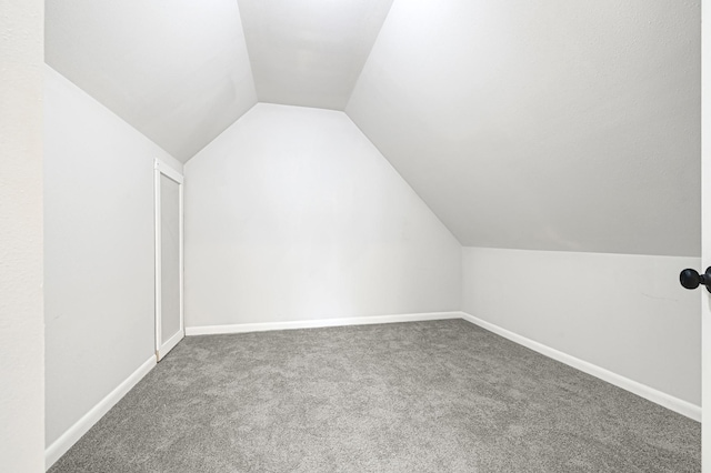 124 Rolling Wood Dr, Baytown, TX 77520 - bonus room with carpet flooring, lofted ceiling, and baseboards