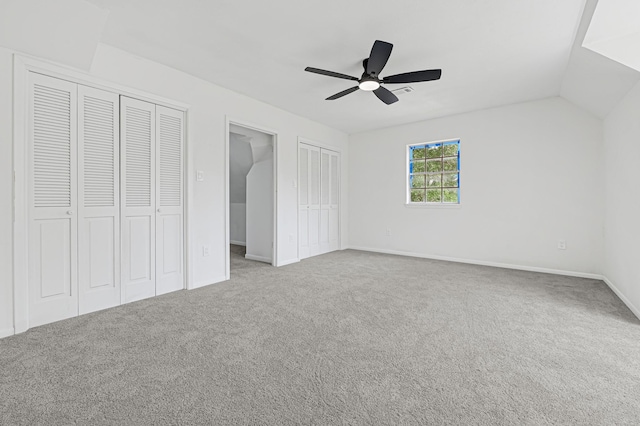 124 Rolling Wood Dr, Baytown, TX 77520 - unfurnished bedroom with multiple closets, carpet flooring, baseboards, and a ceiling fan