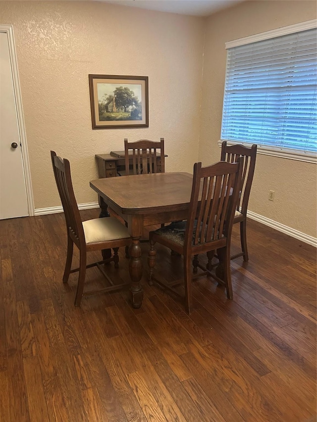 13802 Waterville Way, Houston, TX 77015 - dining room with wood finished floors, a textured wall, and baseboards