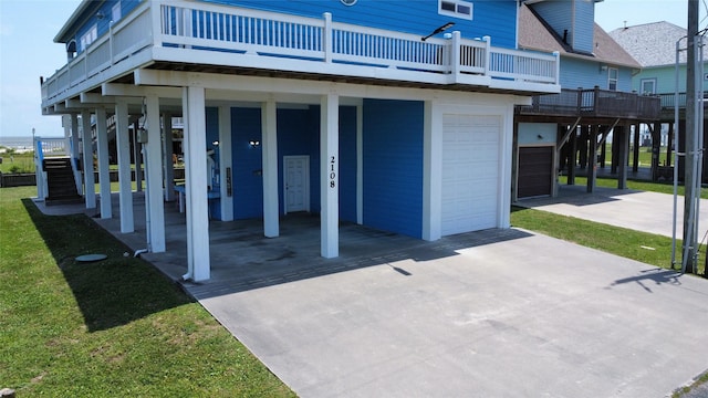 2108 Mills, Crystal Beach, TX 77650 - view of patio / terrace featuring an attached garage, driveway, and stairs