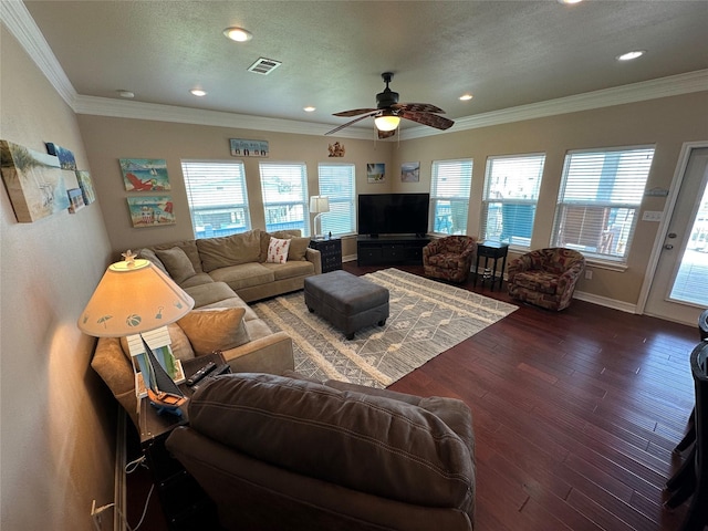 2108 Mills, Crystal Beach, TX 77650 - living area featuring ceiling fan, dark wood-style flooring, recessed lighting, baseboards, and crown molding