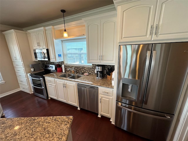 2108 Mills, Crystal Beach, TX 77650 - kitchen with appliances with stainless steel finishes, a sink, dark wood-style flooring, tasteful backsplash, and stone countertops