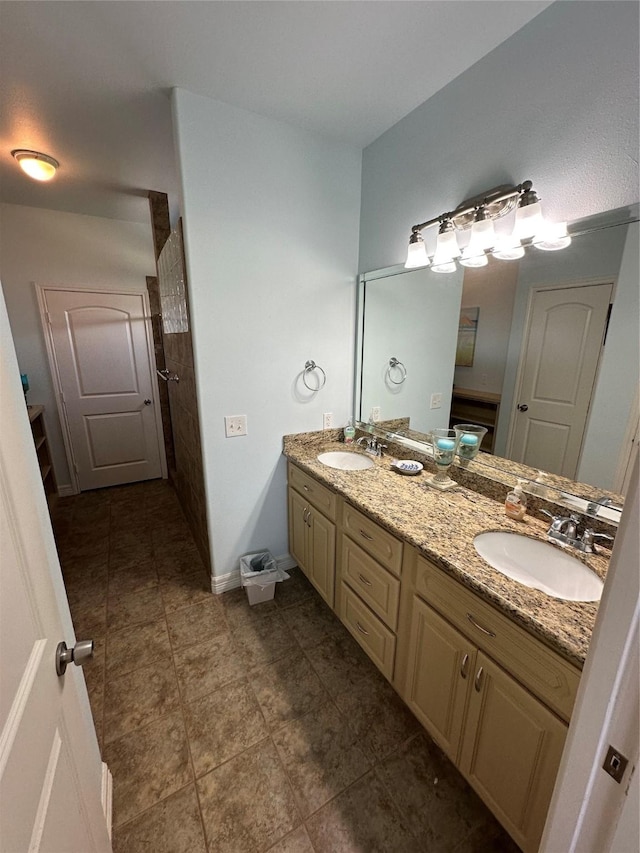 2108 Mills, Crystal Beach, TX 77650 - bathroom featuring double vanity, baseboards, and tile patterned floors