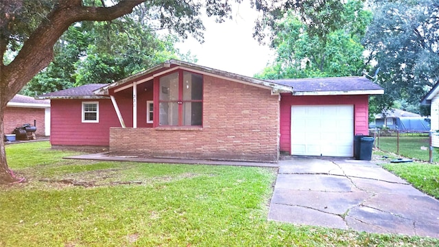 330 Cedar Dr, Hitchcock, TX 77563 - view of front of home with concrete driveway, a garage, and brick siding