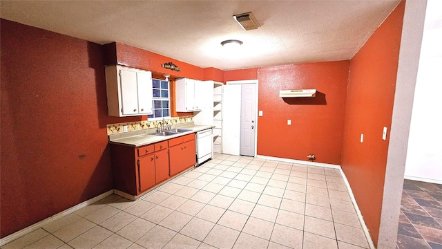 330 Cedar Dr, Hitchcock, TX 77563 - kitchen with dishwasher, a sink, baseboards, under cabinet range hood, and a textured ceiling