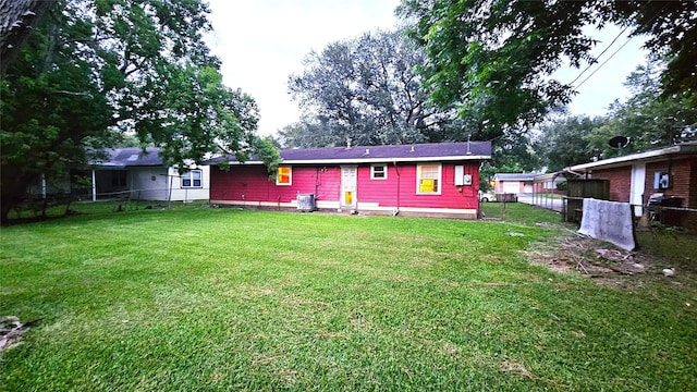 330 Cedar Dr, Hitchcock, TX 77563 - back of property featuring central AC