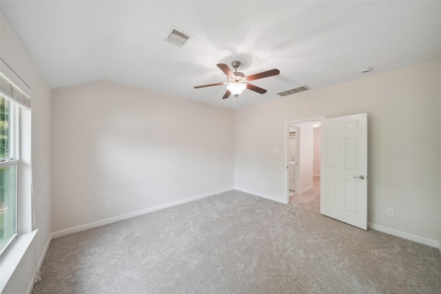 10 Fairlee Ct, The Woodlands, TX 77354 - carpeted empty room with ceiling fan, baseboards, and vaulted ceiling