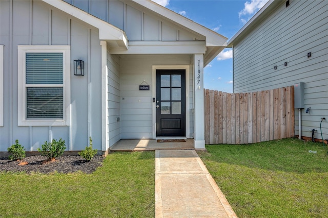 11947 Midas Ln, Willis, TX 77378 - view of exterior entry featuring board and batten siding
