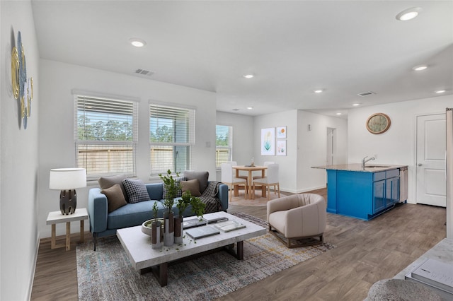 11947 Midas Ln, Willis, TX 77378 - living area with light wood-style flooring, recessed lighting, and baseboards