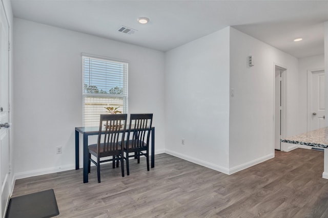 11947 Midas Ln, Willis, TX 77378 - dining space with wood finished floors, baseboards, and recessed lighting