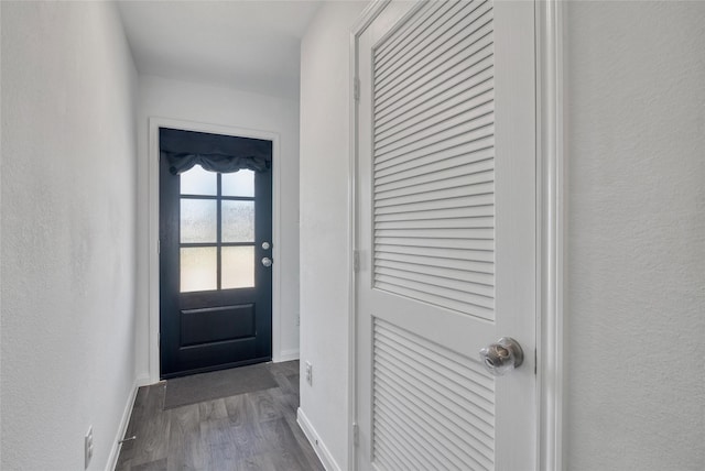 11947 Midas Ln, Willis, TX 77378 - entryway featuring dark wood finished floors and baseboards