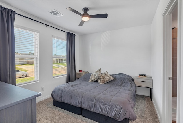 11947 Midas Ln, Willis, TX 77378 - carpeted bedroom with baseboards and ceiling fan
