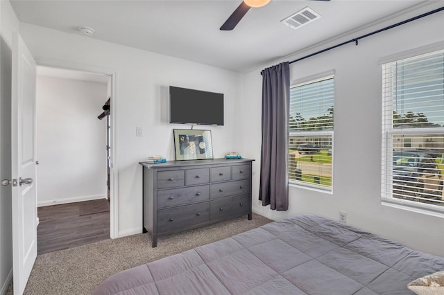 11947 Midas Ln, Willis, TX 77378 - carpeted bedroom with baseboards and ceiling fan
