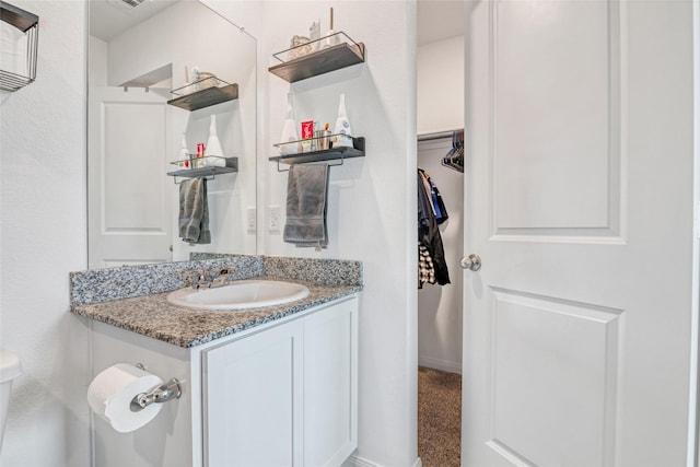 11947 Midas Ln, Willis, TX 77378 - half bathroom with vanity and toilet