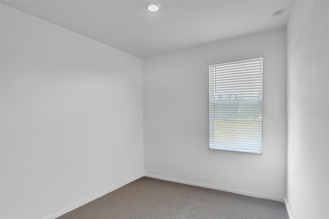 11947 Midas Ln, Willis, TX 77378 - carpeted empty room with a smoke detector and baseboards