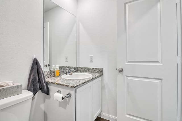 11947 Midas Ln, Willis, TX 77378 - half bath with vanity, toilet, and a textured wall
