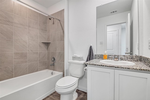 11947 Midas Ln, Willis, TX 77378 - bathroom with toilet, vanity, bathing tub / shower combination, and wood finished floors