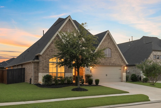 2915 Finch Ct, Katy, TX 77493 - french provincial home with brick siding, driveway, roof with shingles, a garage, and stone siding