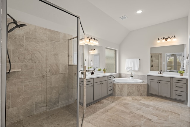 2915 Finch Ct, Katy, TX 77493 - full bathroom with a stall shower, a garden tub, two vanities, lofted ceiling, and recessed lighting