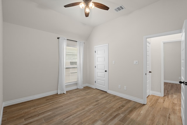 2915 Finch Ct, Katy, TX 77493 - unfurnished bedroom with light wood-style floors, baseboards, lofted ceiling, and a ceiling fan