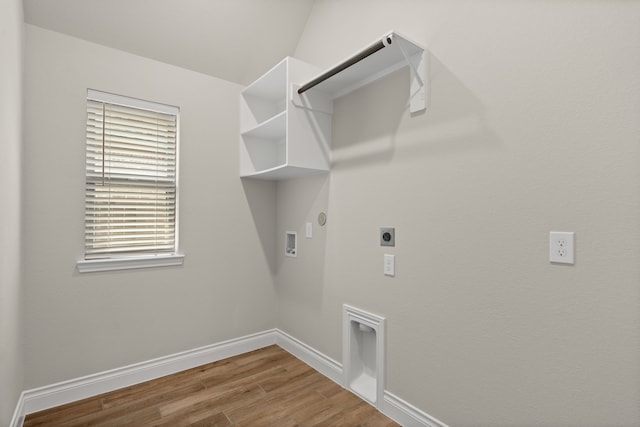 2915 Finch Ct, Katy, TX 77493 - laundry room with hookup for an electric dryer, hookup for a gas dryer, hookup for a washing machine, wood finished floors, and baseboards