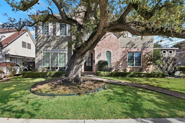 2202 Sul Ross St, Houston, TX 77098 - traditional-style home with brick siding and a front lawn