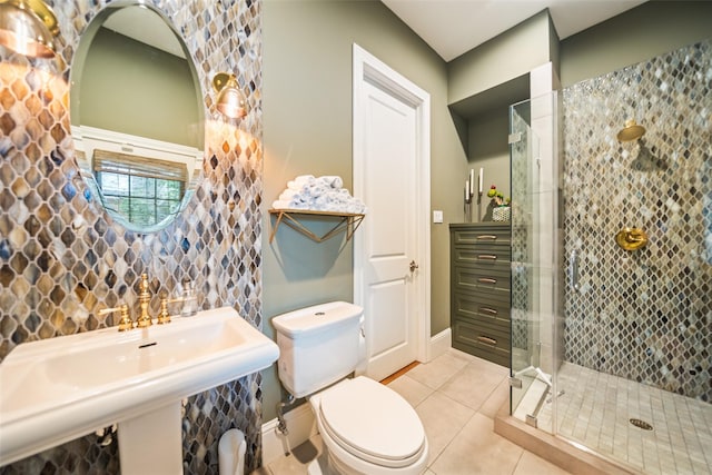 2202 Sul Ross St, Houston, TX 77098 - bathroom with a stall shower, toilet, tile patterned flooring, a sink, and baseboards